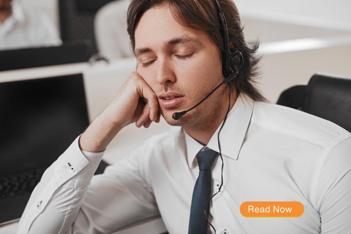 man falling to sleep at desk