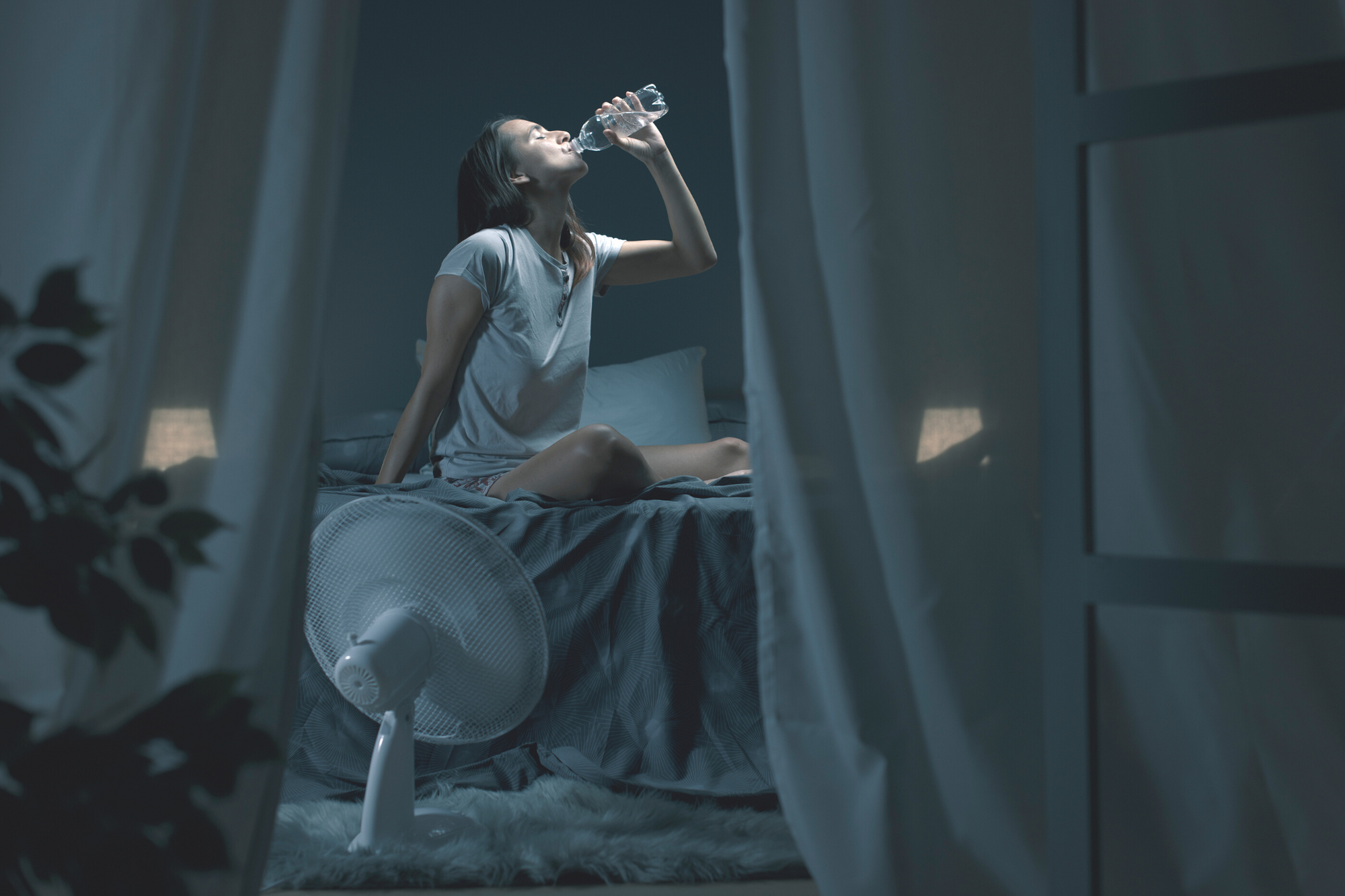lady drinking water, hot, fan 