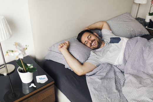 man in bed waking up to a good morning