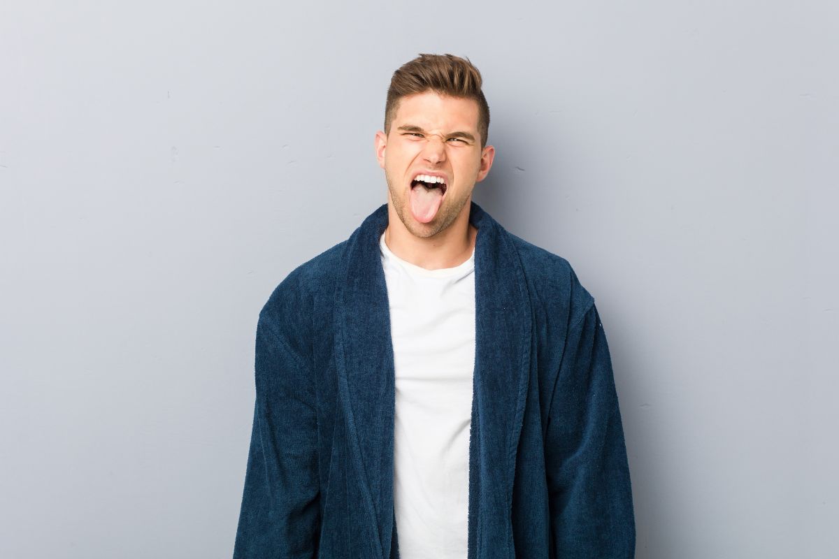 Man sticking tongue out in a funny way