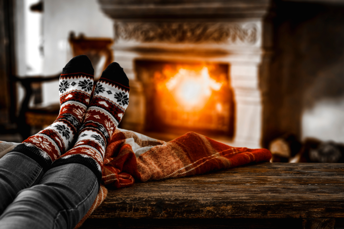 socks on someone staying warm by fire inside