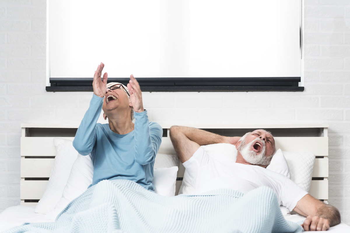 Aging and Snoring man and women in bed