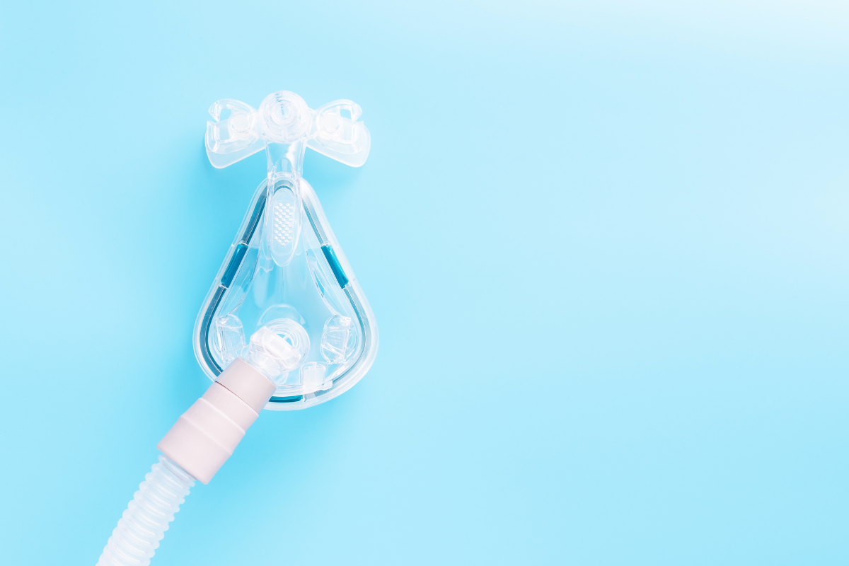 sleep apnea mask on blue background