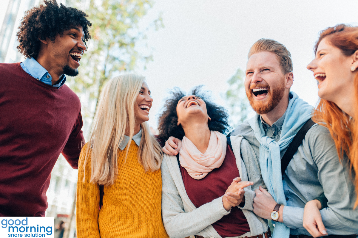 group of multicultural friends laughing