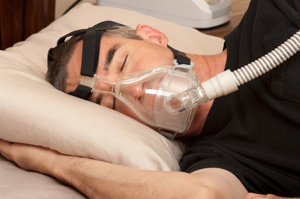 Man sleeping with cpap