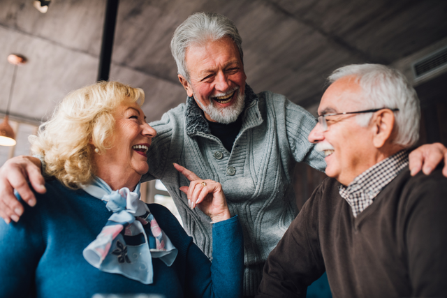 three seniors laughing